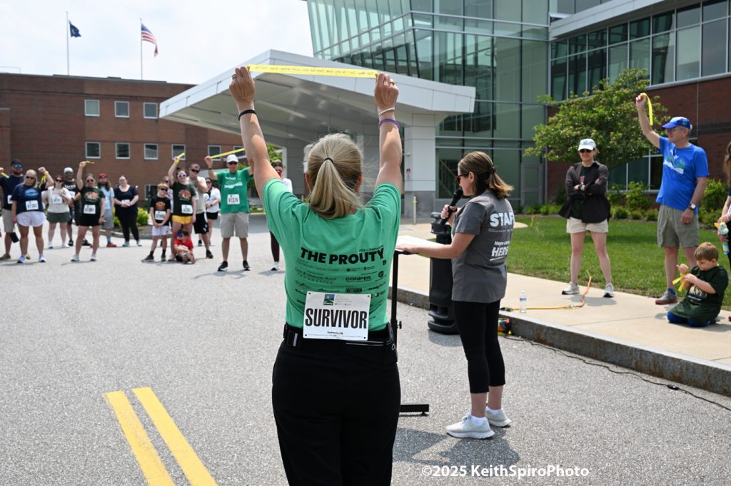 Prouty walk in Manchester. Photo by Keith Spiro of participants hearing a story of survival 